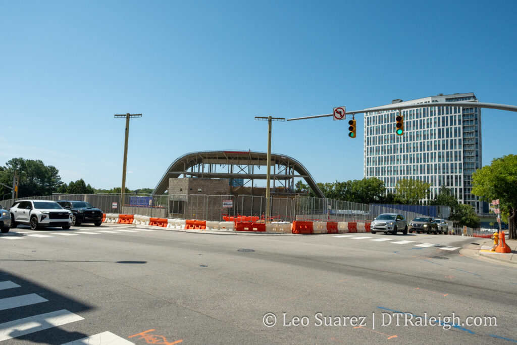 Photo of the corner of Lenoir and McDowell Streets and the construction of the Red Hat Amphitheater, September 2026